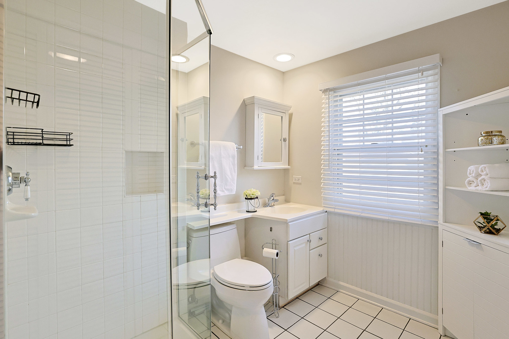 120 South Rohlwing Road Palatine, IL 60074 - Photo 29 of 49 a bathroom with a granite countertop toilet a sink a mirror and a window