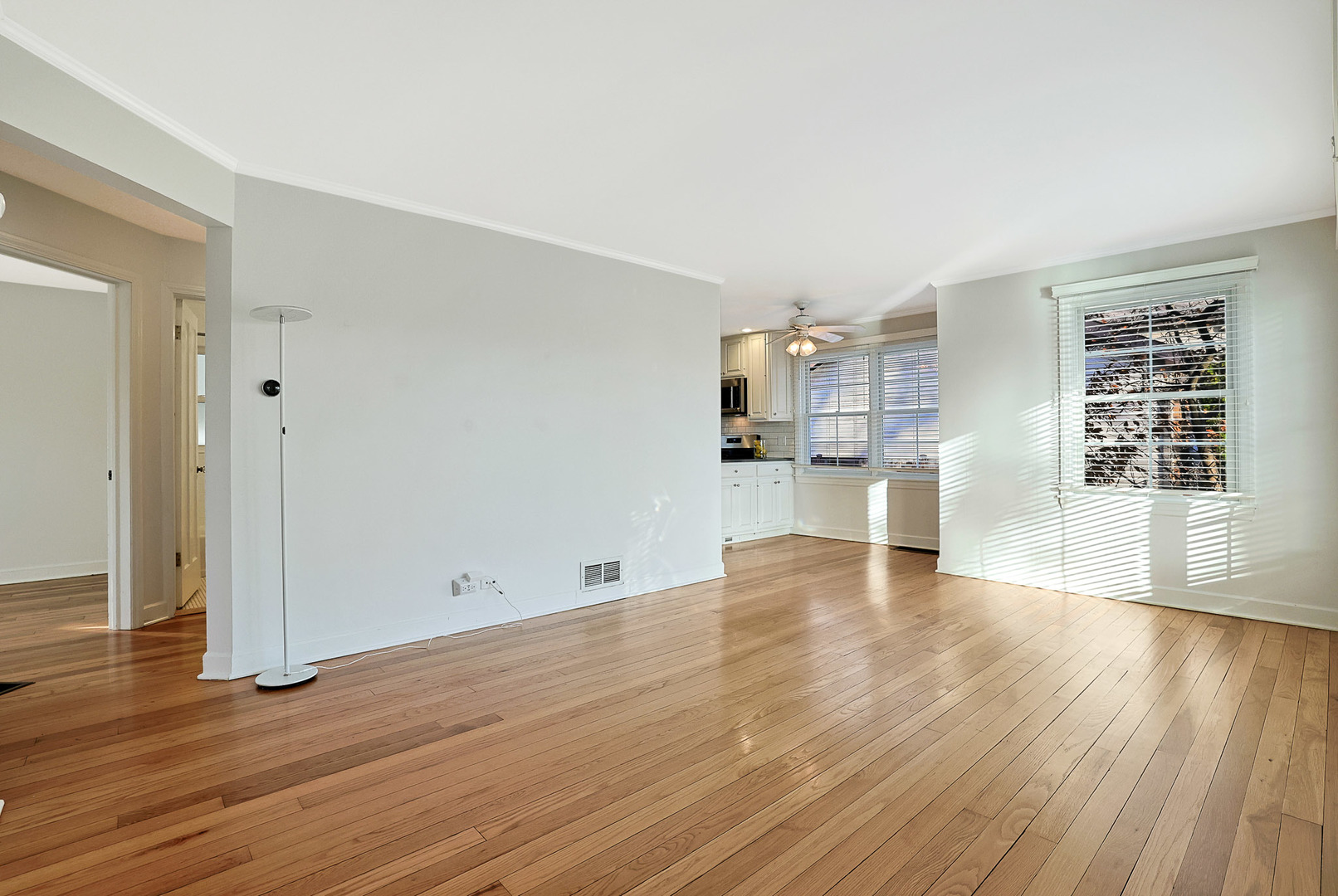 120 South Rohlwing Road Palatine, IL 60074 - Photo 5 of 49 a view of empty room with wooden floor and windows