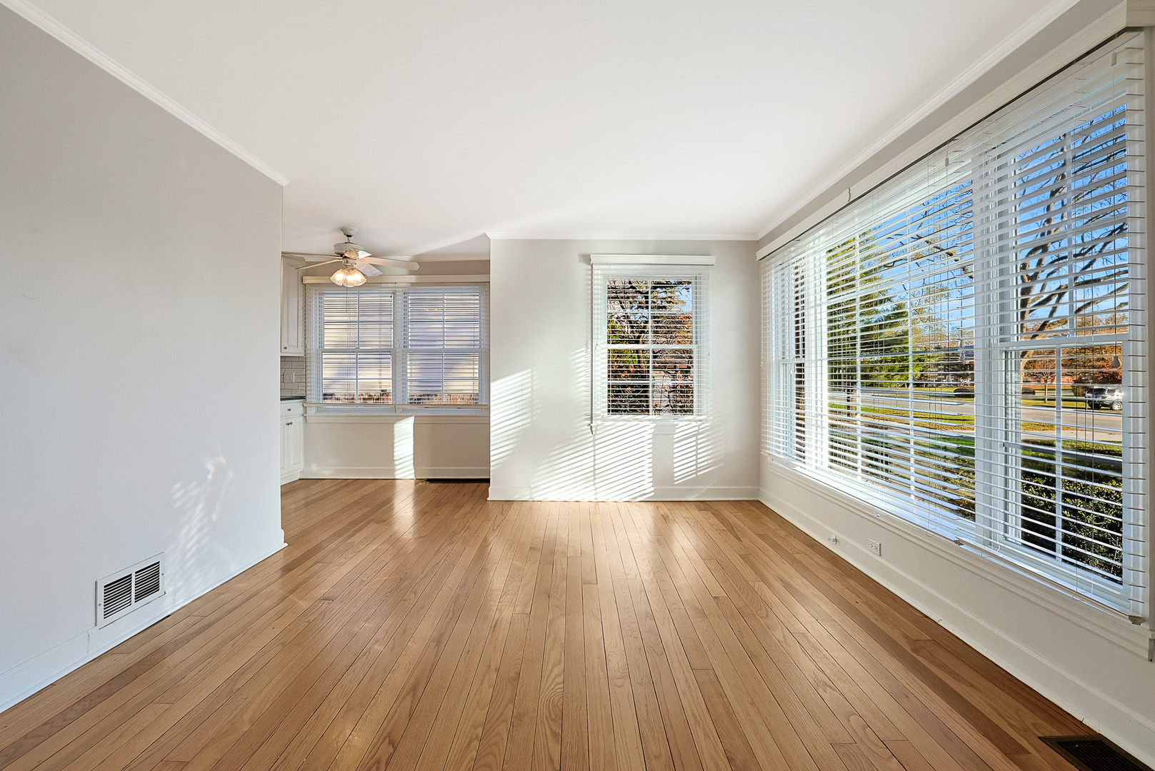 120 South Rohlwing Road Palatine, IL 60074 - Photo 6 of 49 an empty room with wooden floor and windows