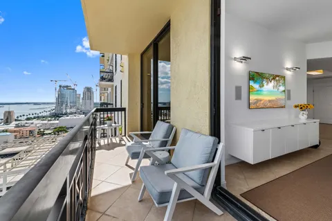 a view of a dining room with furniture and window