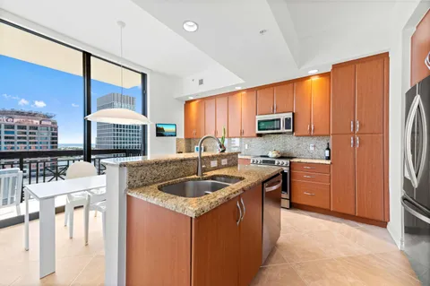 a kitchen with a table chairs and a refrigerator