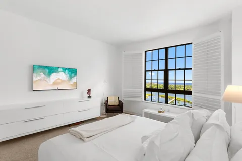 a spacious bathroom with a sink a mirror and a shower