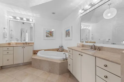 a living room with furniture a flat screen tv and a window