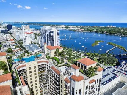 a view of a swimming pool with lounge chairs