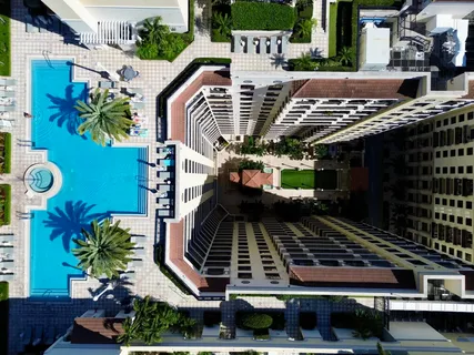 a view of a patio with dining table and chairs