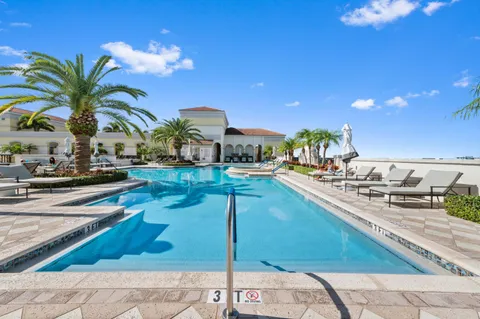 a living room with furniture a rug and a chandelier