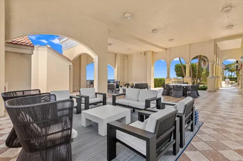 a room with wooden cabinets and outdoor seating