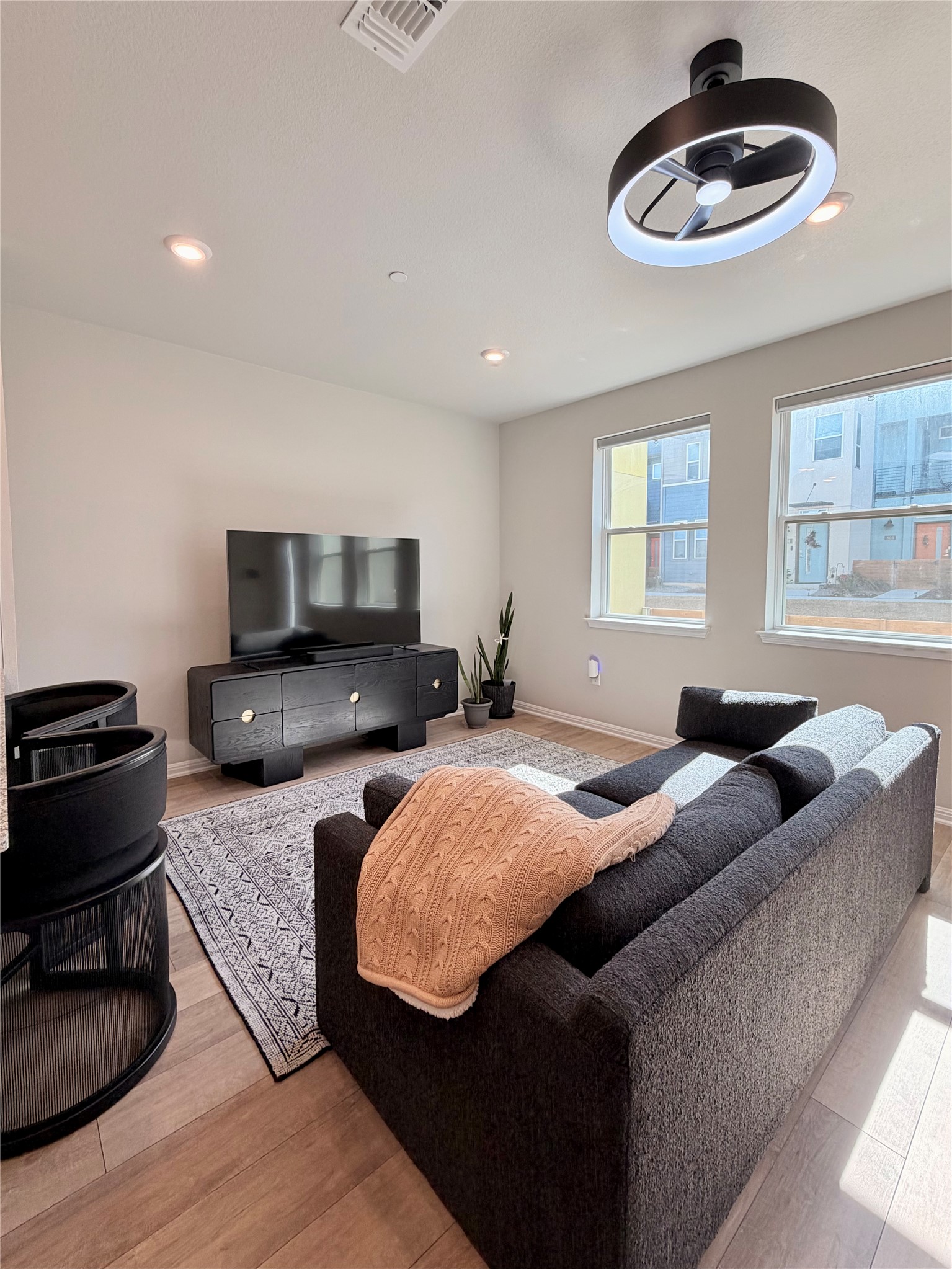 9015 Cattle Baron Path, Unit 1803 Austin, TX 78747 - Photo 2 of 23 Living Room with light wood-type flooring, ceiling fan, and recessed lighting