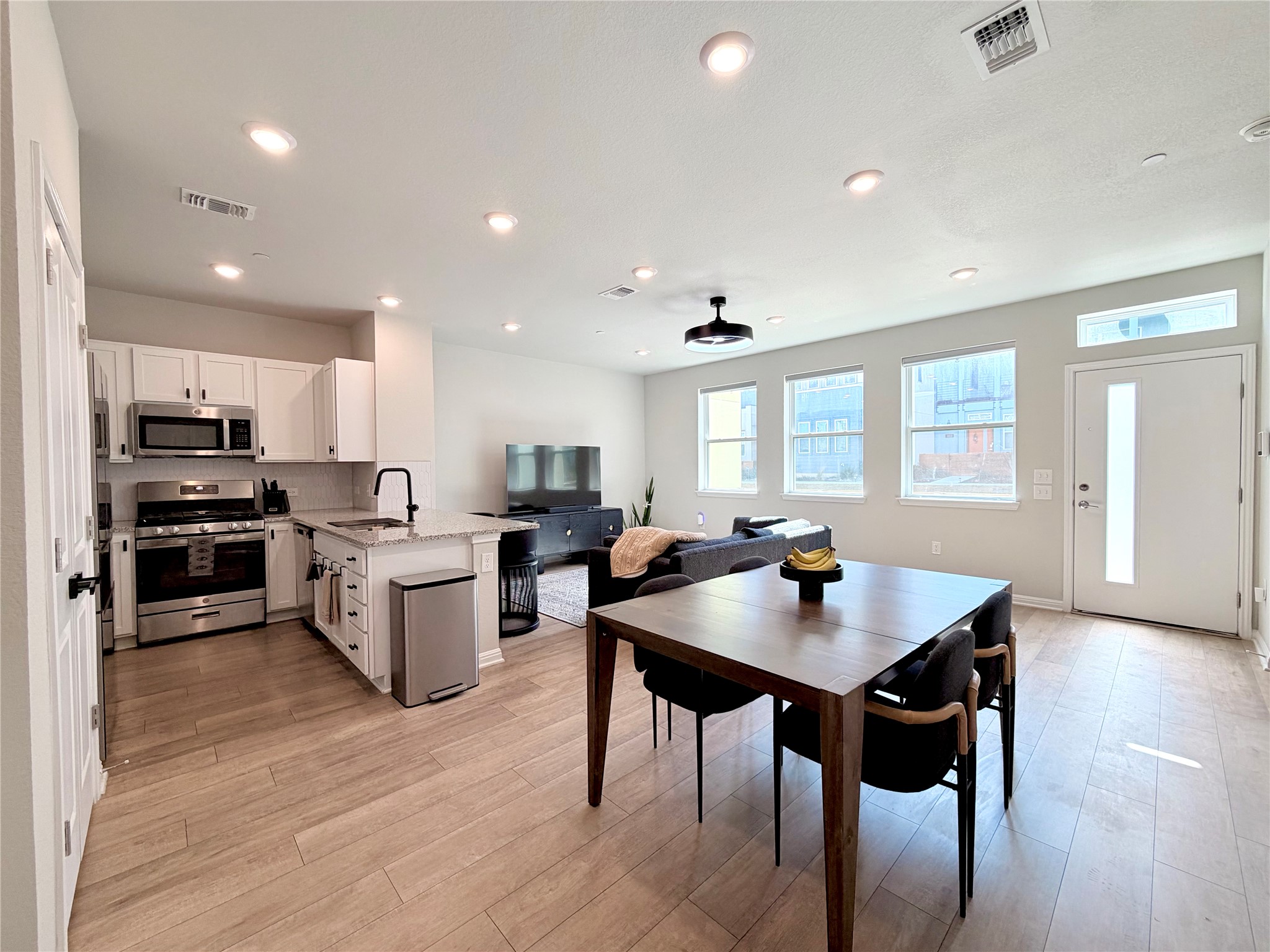 9015 Cattle Baron Path, Unit 1803 Austin, TX 78747 - Photo 7 of 23 Dining space with recessed lighting and light wood-style floors
