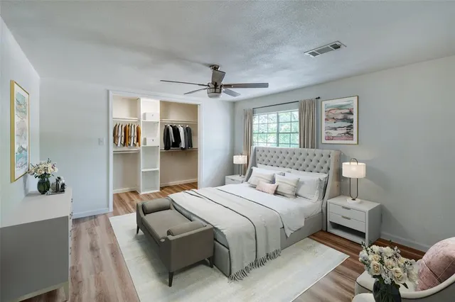 a bedroom with a bed furniture and a window