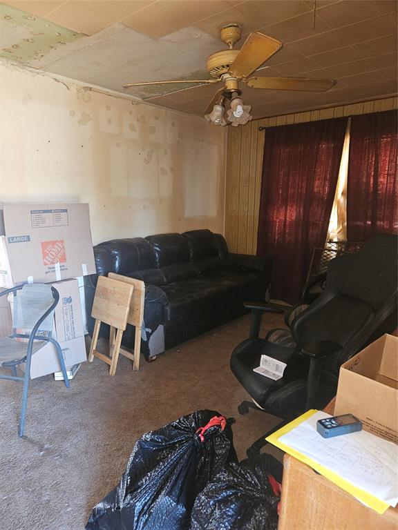 2506 Hillsboro Avenue Dallas, TX 75228 - Photo 2 of 18 a living room with furniture and a chandelier