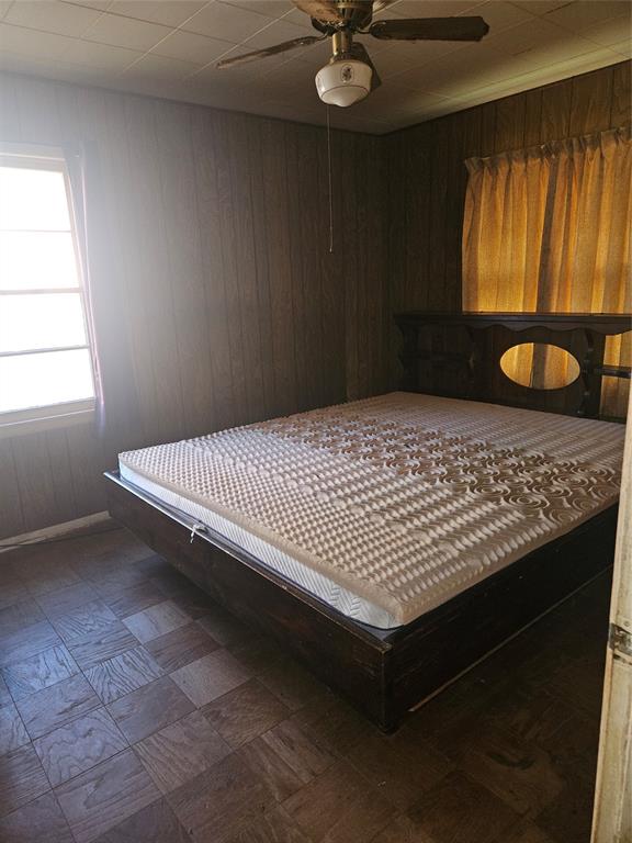 2506 Hillsboro Avenue Dallas, TX 75228 - Photo 9 of 18 a bed sitting in a room next to a window