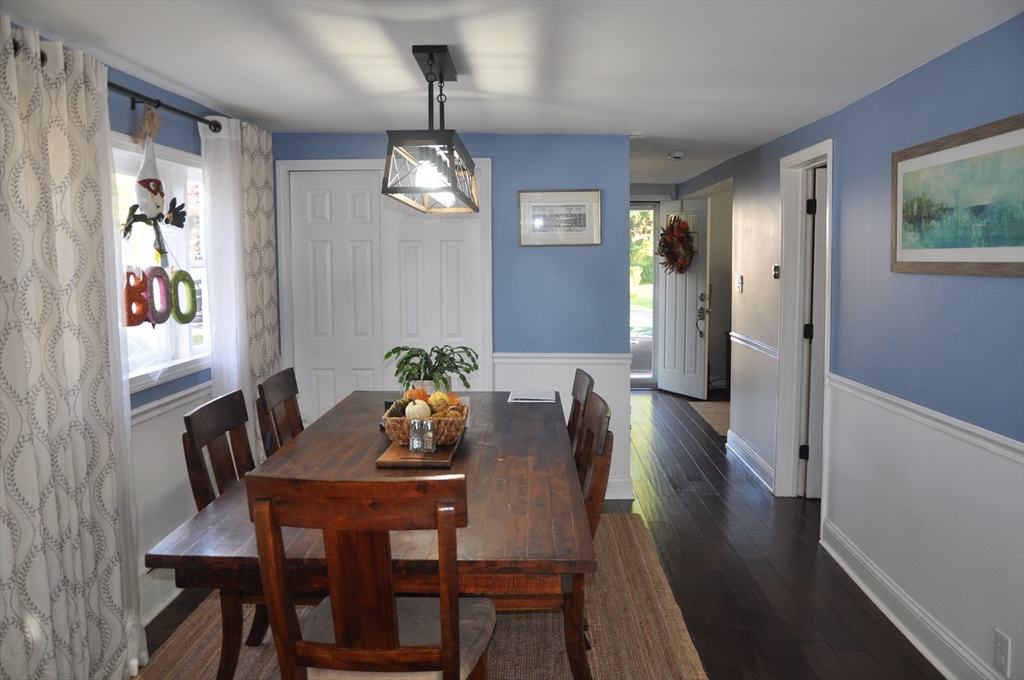 57 Crompton Street Acushnet, MA 02743 - Photo 11 of 21 a view of a dining room with furniture a chandelier and wooden floor