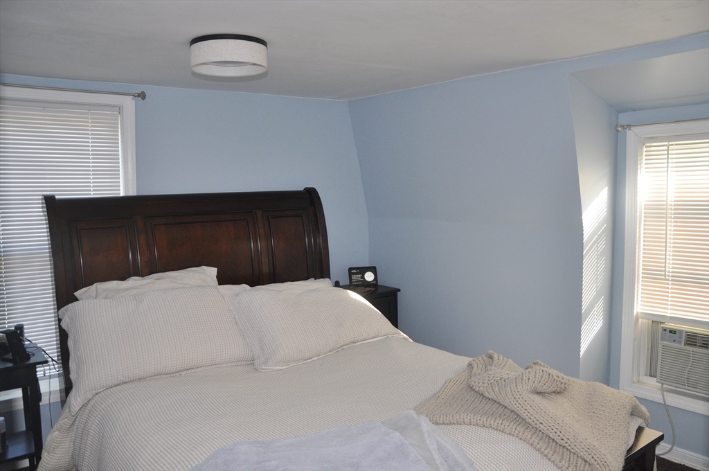57 Crompton Street Acushnet, MA 02743 - Photo 17 of 21 a bedroom with a bed and a window