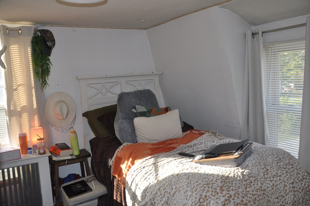 57 Crompton Street Acushnet, MA 02743 - Photo 19 of 21 a bedroom with a bed and a window