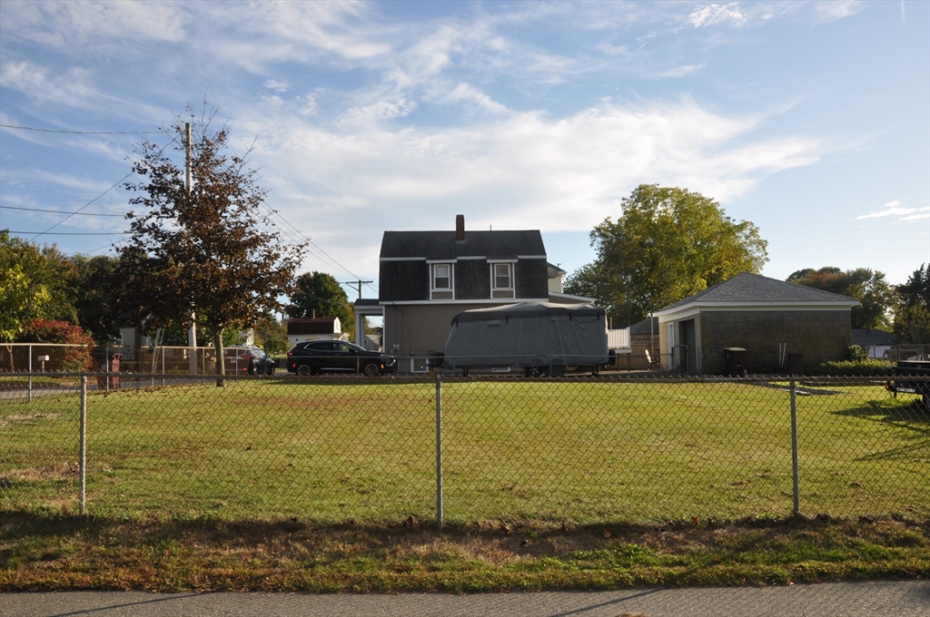 57 Crompton Street Acushnet, MA 02743 - Photo 20 of 21 a front view of a house with a yard