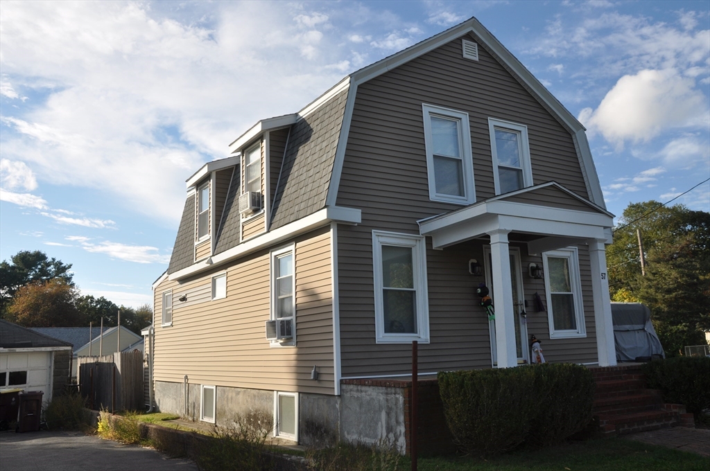 57 Crompton Street Acushnet, MA 02743 - Photo 2 of 21 a view of a house with a yard