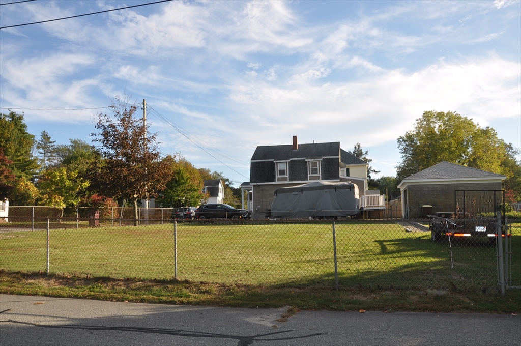 57 Crompton Street Acushnet, MA 02743 - Photo 21 of 21 a front view of a house with garden