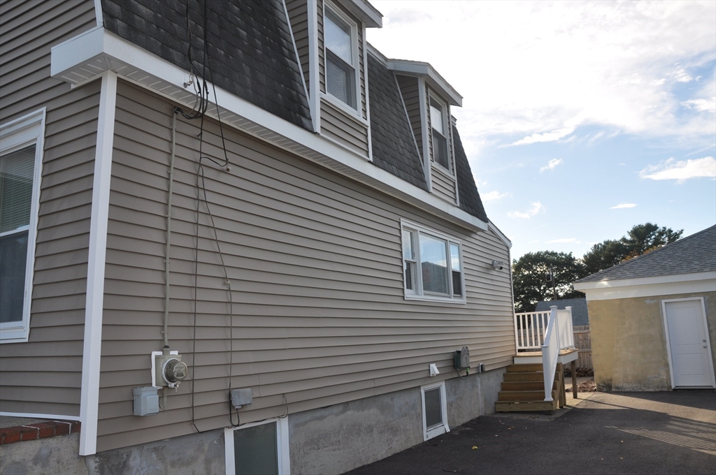 57 Crompton Street Acushnet, MA 02743 - Photo 4 of 21 a view of a house with a street