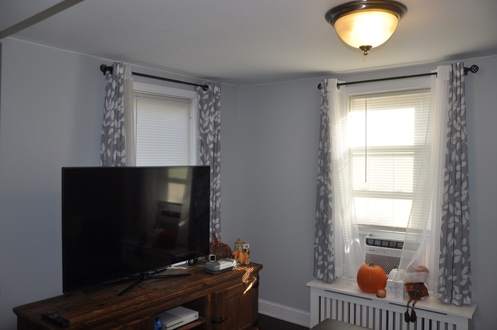 57 Crompton Street Acushnet, MA 02743 - Photo 9 of 21 a living room with furniture and a fireplace