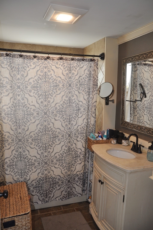57 Crompton Street Acushnet, MA 02743 - Photo 10 of 21 a bathroom with a sink and a mirror