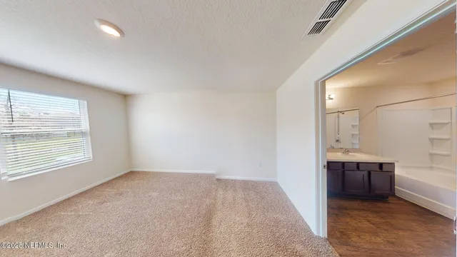 a view of an empty room and window