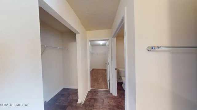 a view of a bathroom from a hallway