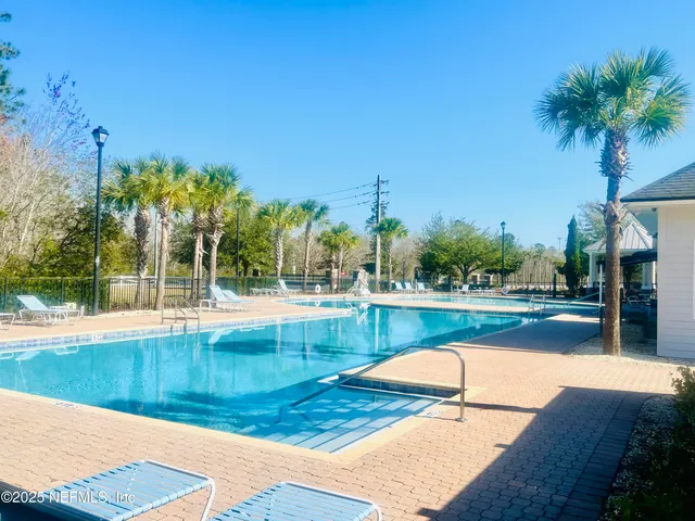a view of swimming pool with a patio