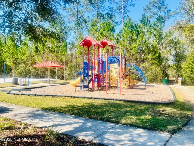 a view of a swimming pool with a yard