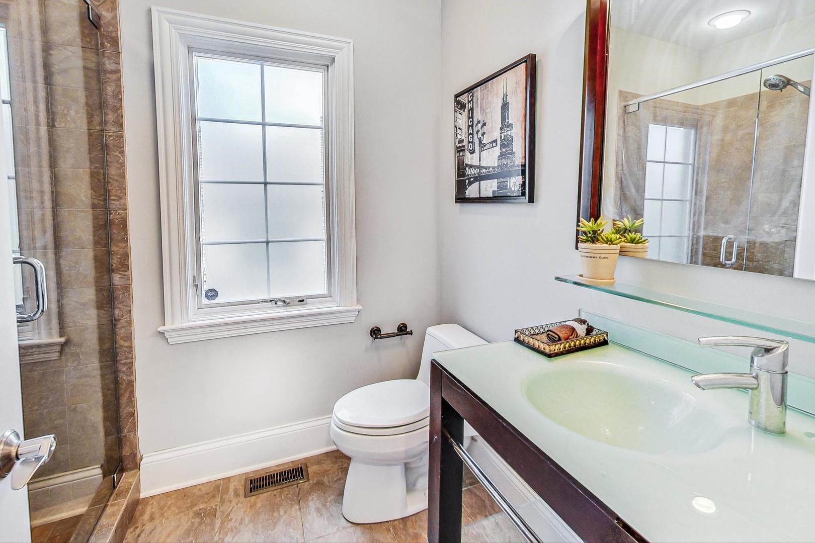 321 Forest Drive Addison, IL 60101 - Photo 13 of 35 a bathroom with a sink and a toilet