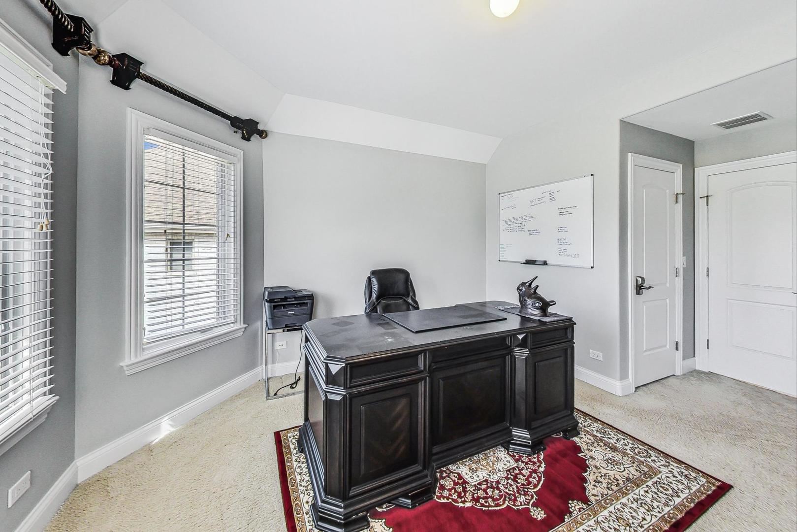 321 Forest Drive Addison, IL 60101 - Photo 18 of 35 a view of a workspace with furniture and a window