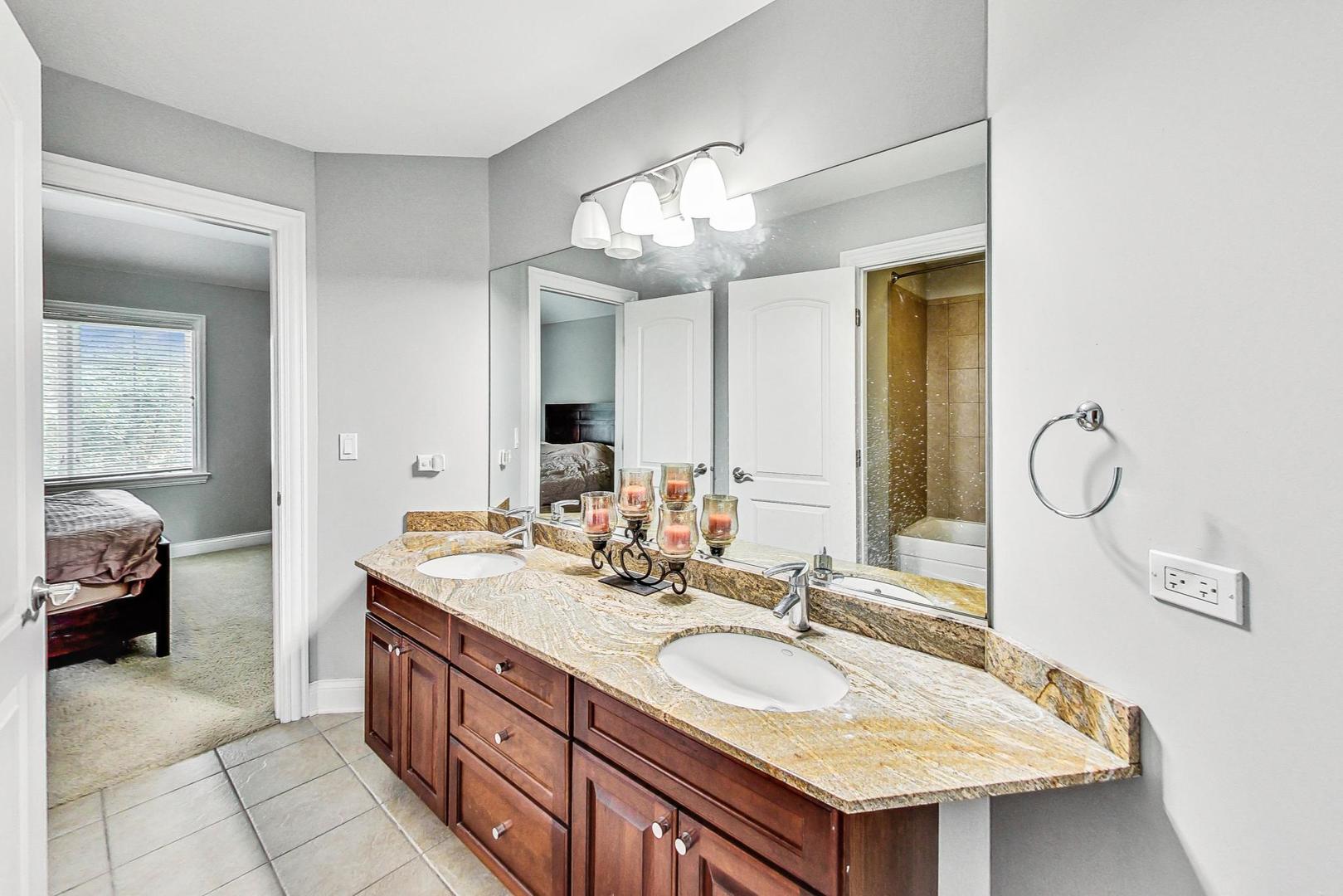 321 Forest Drive Addison, IL 60101 - Photo 19 of 35 a bathroom with a sink double vanity and a mirror