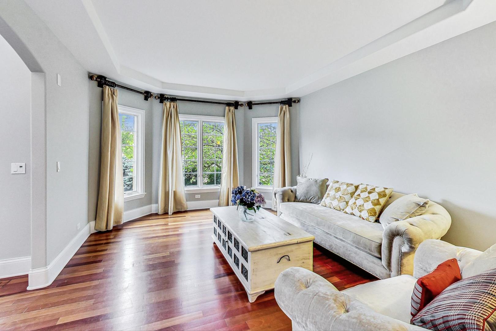 321 Forest Drive Addison, IL 60101 - Photo 2 of 35 a living room with furniture and a large window