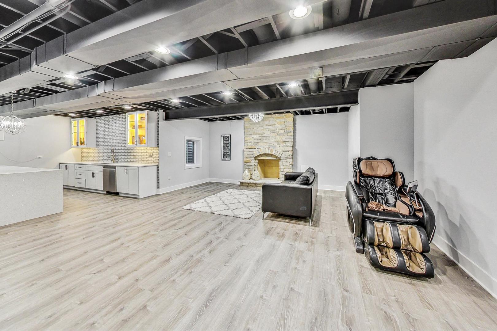321 Forest Drive Addison, IL 60101 - Photo 24 of 35 a utility room with wooden floors and white walls