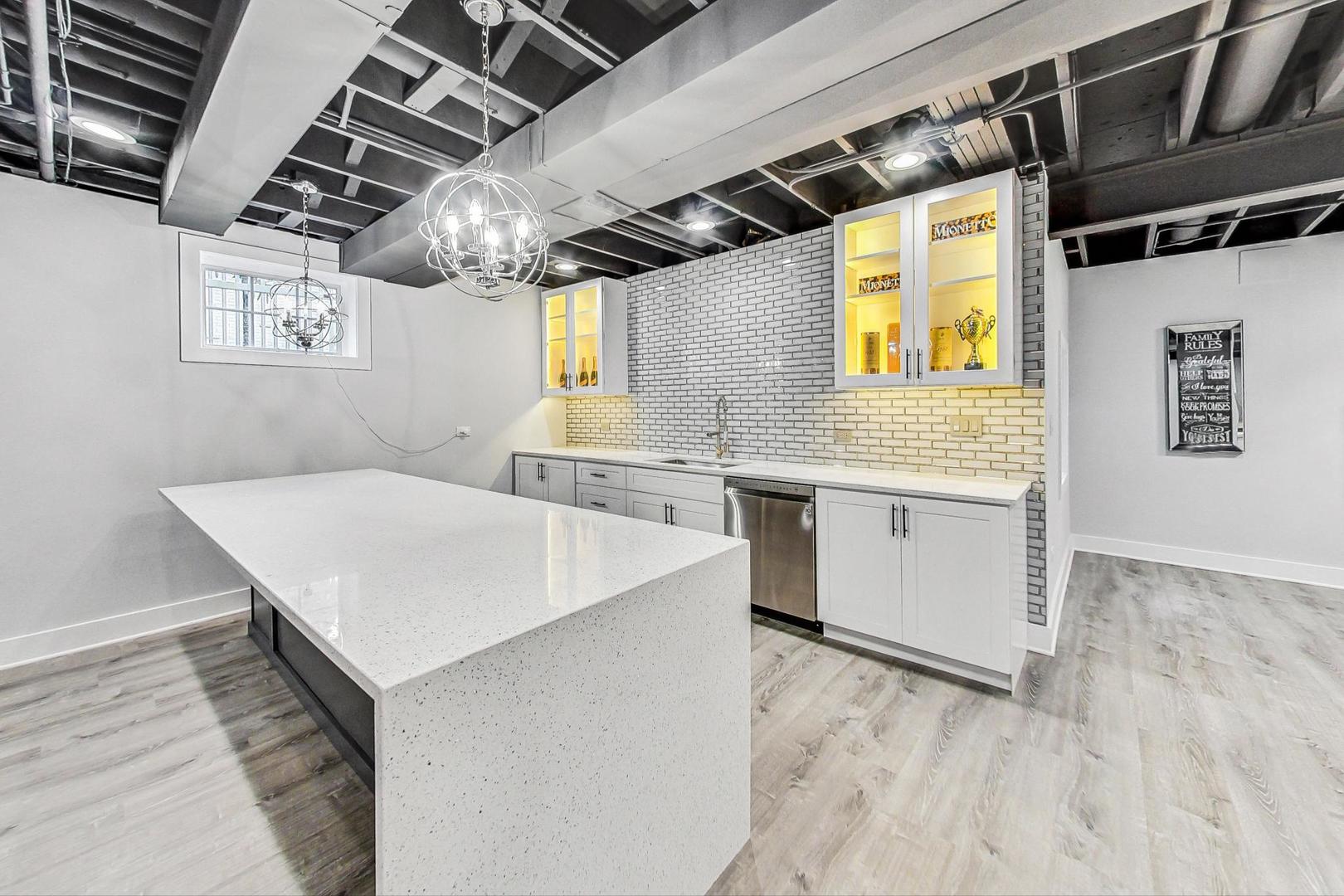 321 Forest Drive Addison, IL 60101 - Photo 26 of 35 a view of a kitchen with a sink and wooden floor