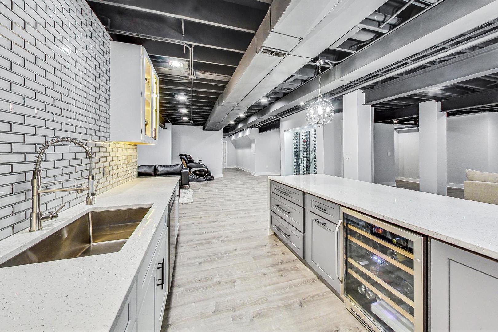 321 Forest Drive Addison, IL 60101 - Photo 27 of 35 a kitchen with stainless steel appliances granite countertop a sink and dishwasher
