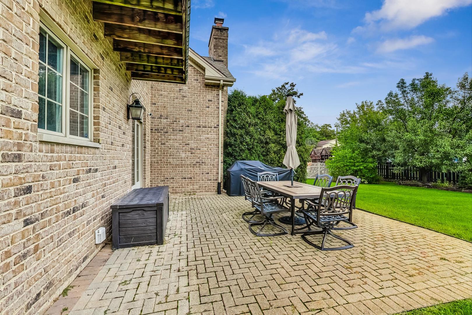 321 Forest Drive Addison, IL 60101 - Photo 30 of 35 a backyard of a house with table and chairs