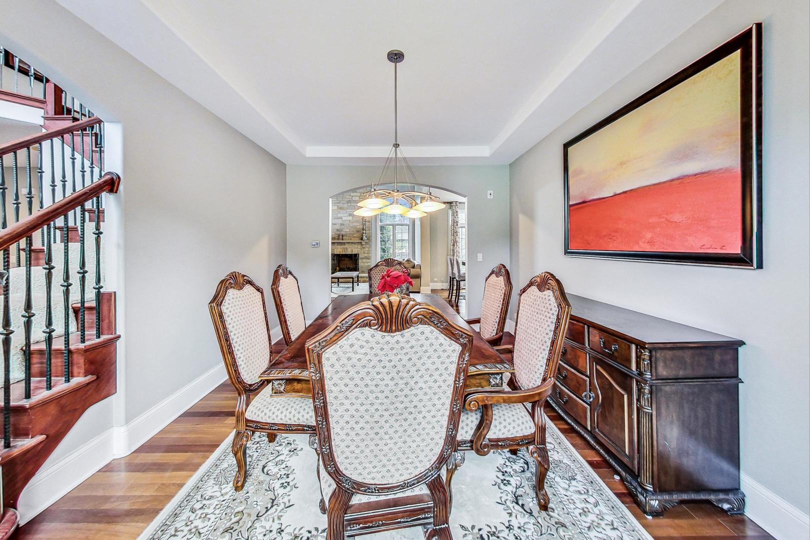 321 Forest Drive Addison, IL 60101 - Photo 3 of 35 a view of a dining room with furniture wooden floor and a chandelier