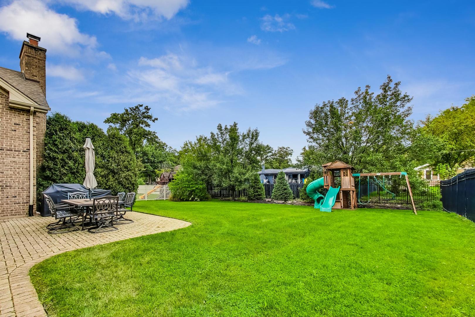321 Forest Drive Addison, IL 60101 - Photo 31 of 35 a view of a backyard with sitting area