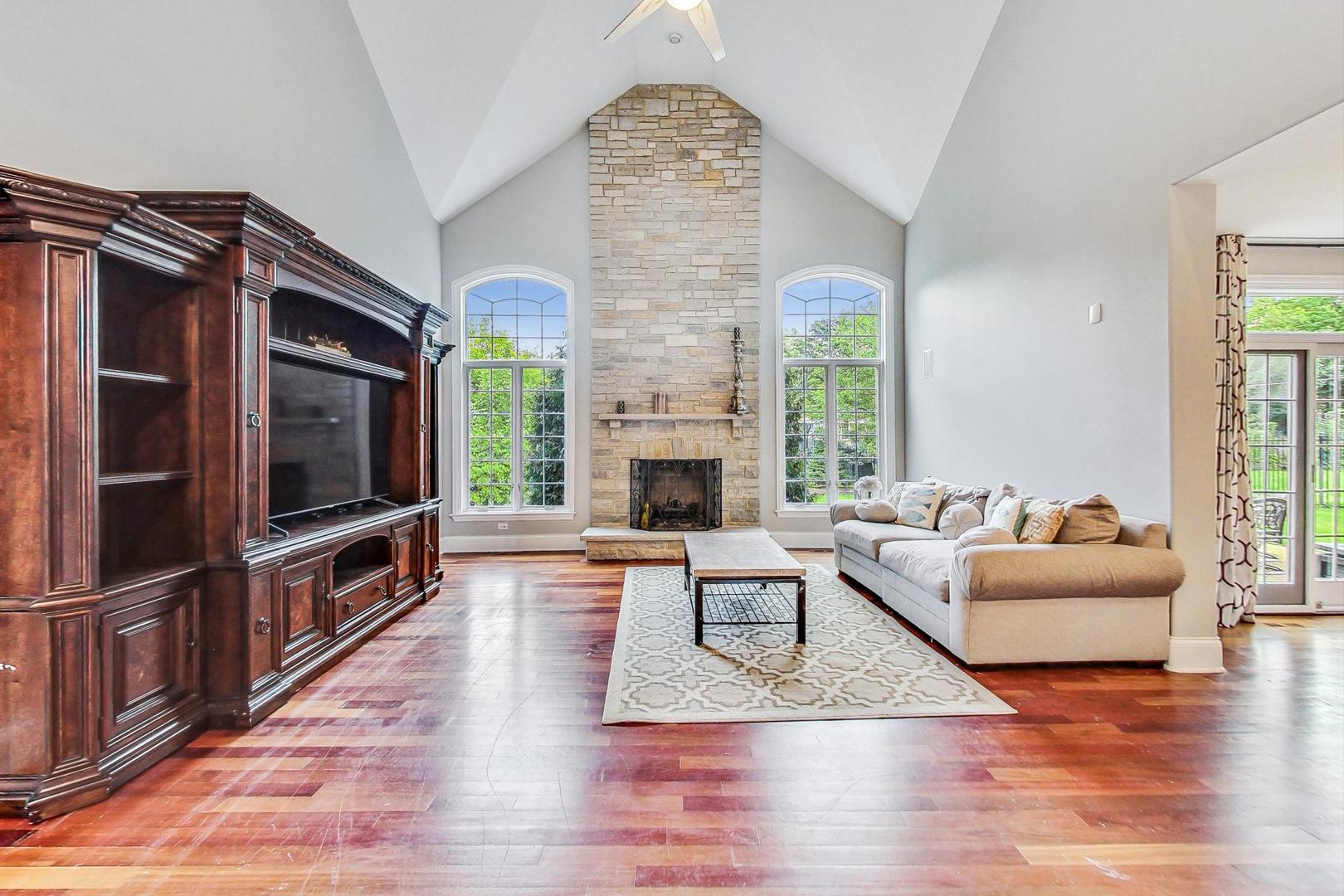 321 Forest Drive Addison, IL 60101 - Photo 10 of 35 a living room with fireplace furniture and a flat screen tv