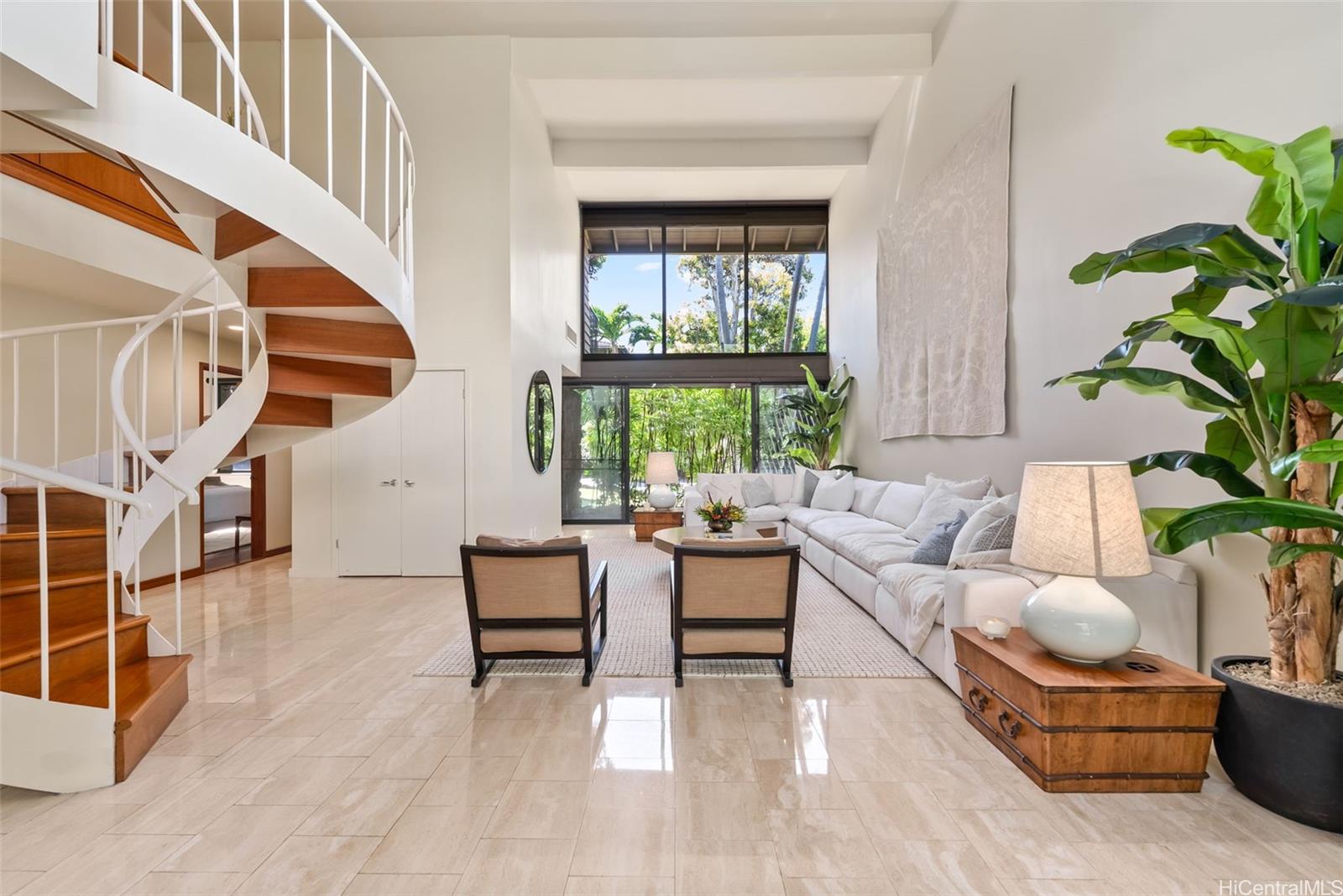 3020 La Pietra Circle, Unit 5 Honolulu, HI 96815 - Photo 1 of 25 a living room with furniture and a potted plant