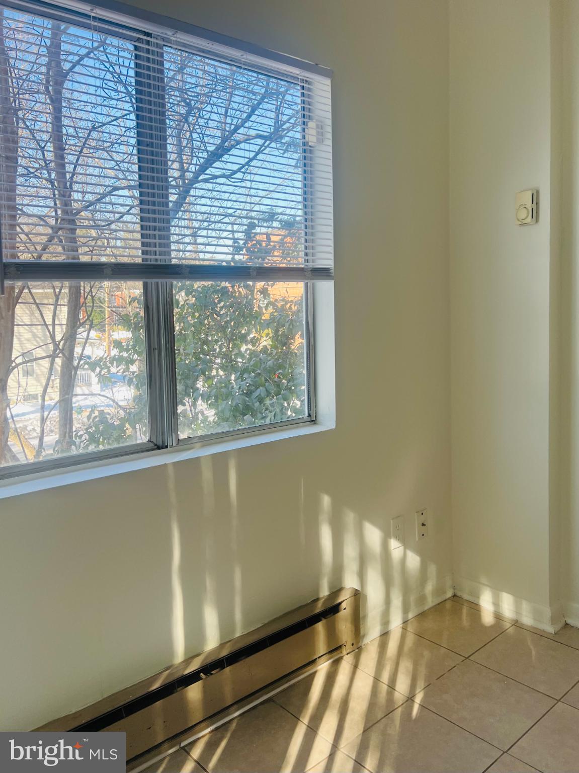 4901 Fitch Place Northeast Washington, DC 20019 - Photo 11 of 47 a view of a room with wooden floor and a window