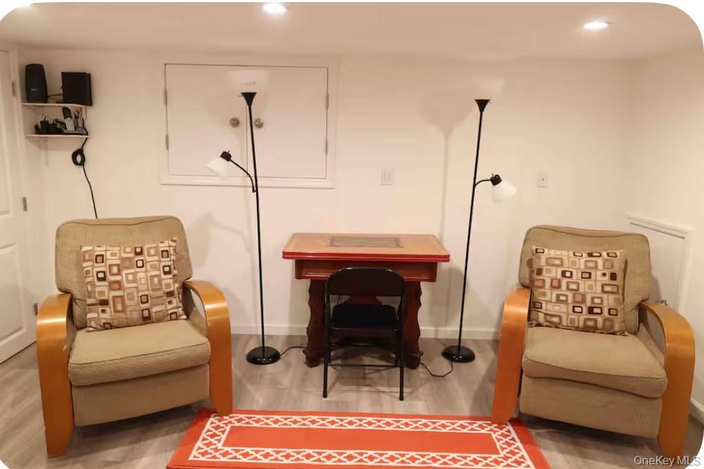 137 Canterbury Road Fort Montgomery, NY 10922 - Photo 11 of 20 a living room with furniture a rug and a chandelier