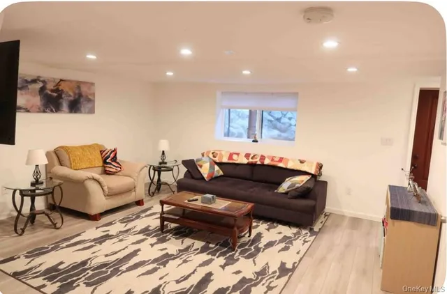 a view of a backyard with a bench and chair