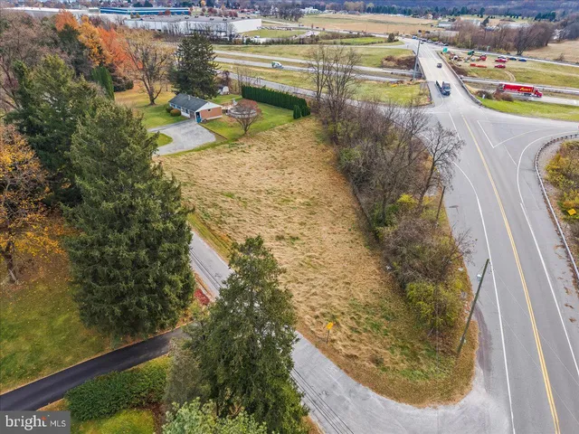 a view of swimming pool with a yard and seating space