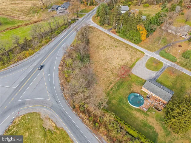 a view of a swimming pool with a outdoor seating