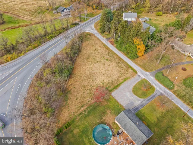 a view of yard with swimming pool and green space