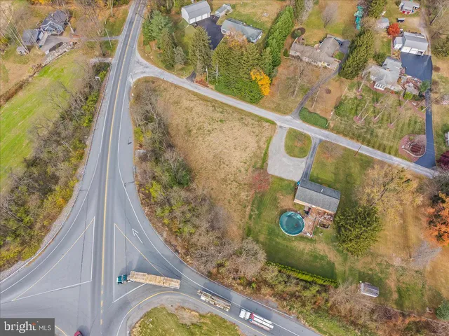 a view of a swimming pool with seating area