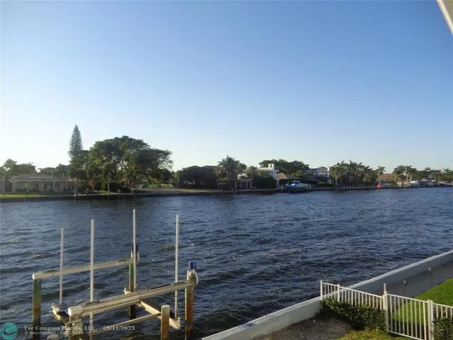 a view of wooden floor with a lake