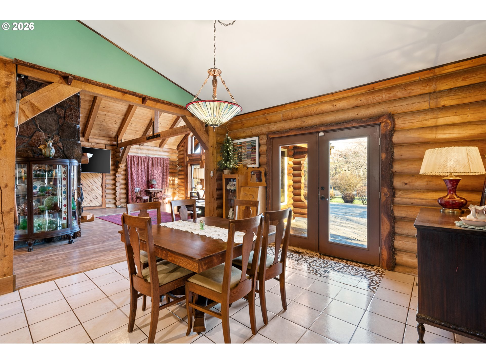 74091 Thornhollow Road Adams, OR 97810 - Photo 15 of 48 a view of a dining room and livingroom with furniture wooden floor a chandelier